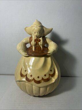 Cream and Brown Ceramic Dutch Girl Decorative Jar